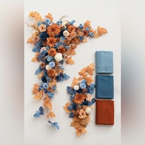 Wedding Arch Floral Arrangement with Blue and Orange Accents